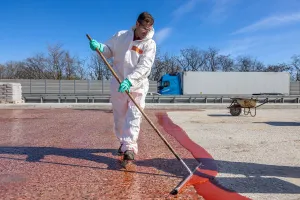 The concrete surface is pre-treated with MBC-VT 116 from MC-Bauchemie prior to scratch coat application.